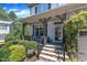 Inviting front porch with stone steps, decorative plants, and comfortable seating area at 6509 Conaway Ct, Wake Forest, NC 27587