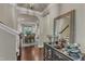 Elegant hallway featuring a bar, hardwood floors and a view of the dining room at 6509 Conaway Ct, Wake Forest, NC 27587