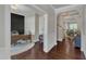 Elegant foyer featuring wood floors and millwork, leading to an office and dining area at 6509 Conaway Ct, Wake Forest, NC 27587