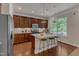 Kitchen island features pendant lighting, granite countertops, and seating for three at 6509 Conaway Ct, Wake Forest, NC 27587