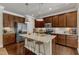 Kitchen with granite countertops, stainless steel appliances, and hardwood floors at 6509 Conaway Ct, Wake Forest, NC 27587