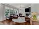Spacious living room with hardwood floors, fireplace, and large windows at 6509 Conaway Ct, Wake Forest, NC 27587
