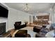 Open-concept living room with hardwood floors, fireplace, and adjacent kitchen at 6509 Conaway Ct, Wake Forest, NC 27587