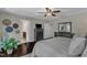 Airy main bedroom with lots of light, hardwood floors, and a view of the connected bathroom at 6509 Conaway Ct, Wake Forest, NC 27587