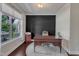 Comfortable home office with a large window, a stylish desk, and a cozy rug at 6509 Conaway Ct, Wake Forest, NC 27587