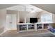 Lofted attic space with built-in shelving, a ceiling fan, and carpet flooring at 709 Bonhurst Dr, Holly Springs, NC 27540