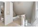 Attic space with carpet flooring, built-in shelving, and natural light from windows at 709 Bonhurst Dr, Holly Springs, NC 27540
