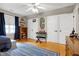 Bedroom featuring hardwood floors, white trim, and closet storage space at 709 Bonhurst Dr, Holly Springs, NC 27540