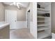 Bedroom with neutral walls, carpet flooring, and built-in bookshelf at 709 Bonhurst Dr, Holly Springs, NC 27540
