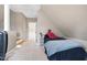 Bedroom with carpeted floor and stairway access at 709 Bonhurst Dr, Holly Springs, NC 27540