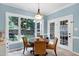 Sun-filled breakfast area featuring garden views and access to the backyard at 709 Bonhurst Dr, Holly Springs, NC 27540