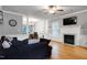Spacious living room with fireplace and dining area at 709 Bonhurst Dr, Holly Springs, NC 27540