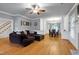 Open-concept living room with hardwood floors and natural light throughout at 709 Bonhurst Dr, Holly Springs, NC 27540