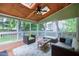 Relaxing screened porch with comfortable seating and tranquil outdoor views at 709 Bonhurst Dr, Holly Springs, NC 27540