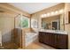 Relaxing bathroom boasts a shower, tub, and dual vanity sinks with dark wood cabinets at 744 Birch Arbor Cir, Raleigh, NC 27604