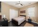 Cozy bedroom featuring hardwood floors, neutral paint, ceiling fan, closet, and a window at 744 Birch Arbor Cir, Raleigh, NC 27604