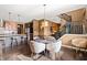 Open dining area with a round table and chairs, adjacent to the kitchen and staircase at 744 Birch Arbor Cir, Raleigh, NC 27604