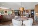Bright open-concept space with a dining area, seamlessly connecting the kitchen, living room, and outdoor deck at 744 Birch Arbor Cir, Raleigh, NC 27604