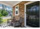 Cozy front porch with chairs, offering a welcoming space to relax and enjoy the neighborhood views at 744 Birch Arbor Cir, Raleigh, NC 27604