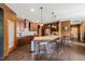 Well-equipped kitchen island with barstool seating, pendant lighting, and stainless steel appliances at 744 Birch Arbor Cir, Raleigh, NC 27604