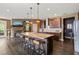Stylish kitchen island with barstool seating, pendant lights, and modern appliances at 744 Birch Arbor Cir, Raleigh, NC 27604