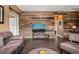 Modern living room featuring a decorative wood accent wall and comfortable seating arrangement at 744 Birch Arbor Cir, Raleigh, NC 27604