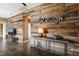 Modern living room featuring a decorative wood accent wall with rustic elements and stylish decor at 744 Birch Arbor Cir, Raleigh, NC 27604