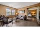 Cozy living room with comfortable seating, ample natural light, and an open entryway to the bedroom at 744 Birch Arbor Cir, Raleigh, NC 27604