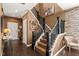 Elegant staircase with dark wood and white accents, leading to the upper level at 744 Birch Arbor Cir, Raleigh, NC 27604