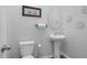 Powder room with pedestal sink and neutral tones at 98 Panmure, Rocky Mount, NC 27804