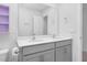 Modern bathroom with double sinks, gray cabinets and a large mirror at 98 Panmure, Rocky Mount, NC 27804
