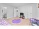 Spacious bedroom featuring a large window, carpeted floors and a TV on a console at 98 Panmure, Rocky Mount, NC 27804