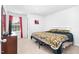 Bedroom features carpeted floors, a large window, and a comfortable bed with stylish bedding at 98 Panmure, Rocky Mount, NC 27804