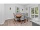 Cozy dining room showcasing modern chairs, a classic table, and ample natural light at 98 Panmure, Rocky Mount, NC 27804