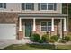 Inviting front porch with stone accents, decorative columns, and a well-maintained lawn at 98 Panmure, Rocky Mount, NC 27804