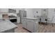 Bright kitchen featuring stainless steel appliances, granite countertops, and an adjacent dining area at 98 Panmure, Rocky Mount, NC 27804