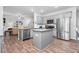 Open kitchen featuring stainless steel appliances, granite countertops, and views into the living room at 98 Panmure, Rocky Mount, NC 27804