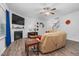 Inviting living room with fireplace, ceiling fan, and wood-look flooring at 98 Panmure, Rocky Mount, NC 27804