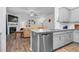 Open floor plan featuring modern kitchen with granite countertops, stainless appliances, and fireplace at 98 Panmure, Rocky Mount, NC 27804