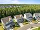 Beautiful aerial view of multiple homes surrounded by mature trees in a lovely neighborhood at 98 Stone Bridge Xing # 98, Chapel Hill, NC 27517