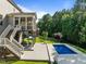 Beautiful backyard featuring screened porch, pool, and green space perfect for outdoor enjoyment at 98 Stone Bridge Xing # 98, Chapel Hill, NC 27517