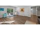 Open basement area with sliding doors to patio, perfect for entertaining and recreation at 98 Stone Bridge Xing # 98, Chapel Hill, NC 27517
