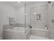 Bright bathroom highlighting the soaking tub, glass shower and tiled walls at 98 Stone Bridge Xing # 98, Chapel Hill, NC 27517