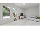 Bright bedroom featuring large windows, modern decor, and plush carpeting for comfort at 98 Stone Bridge Xing # 98, Chapel Hill, NC 27517