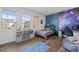 A bedroom with a galaxy mural, storage shelves, and two large windows at 98 Stone Bridge Xing # 98, Chapel Hill, NC 27517