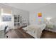 Bright bedroom featuring wood floors, stylish polka dot accent wall, and ample natural light at 98 Stone Bridge Xing # 98, Chapel Hill, NC 27517