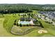 Aerial shot showcasing the community pool, tennis courts, and beautiful landscaping near charming neighborhood homes at 98 Stone Bridge Xing # 98, Chapel Hill, NC 27517