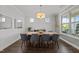 Dining area featuring a sleek table, comfortable seating, modern lighting, and natural light at 98 Stone Bridge Xing # 98, Chapel Hill, NC 27517