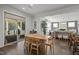 Open concept dining room featuring hardwood floors and access to the outdoor patio at 98 Stone Bridge Xing # 98, Chapel Hill, NC 27517