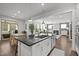 Open concept kitchen featuring a large island, stainless appliances, and hardwood floors at 98 Stone Bridge Xing # 98, Chapel Hill, NC 27517